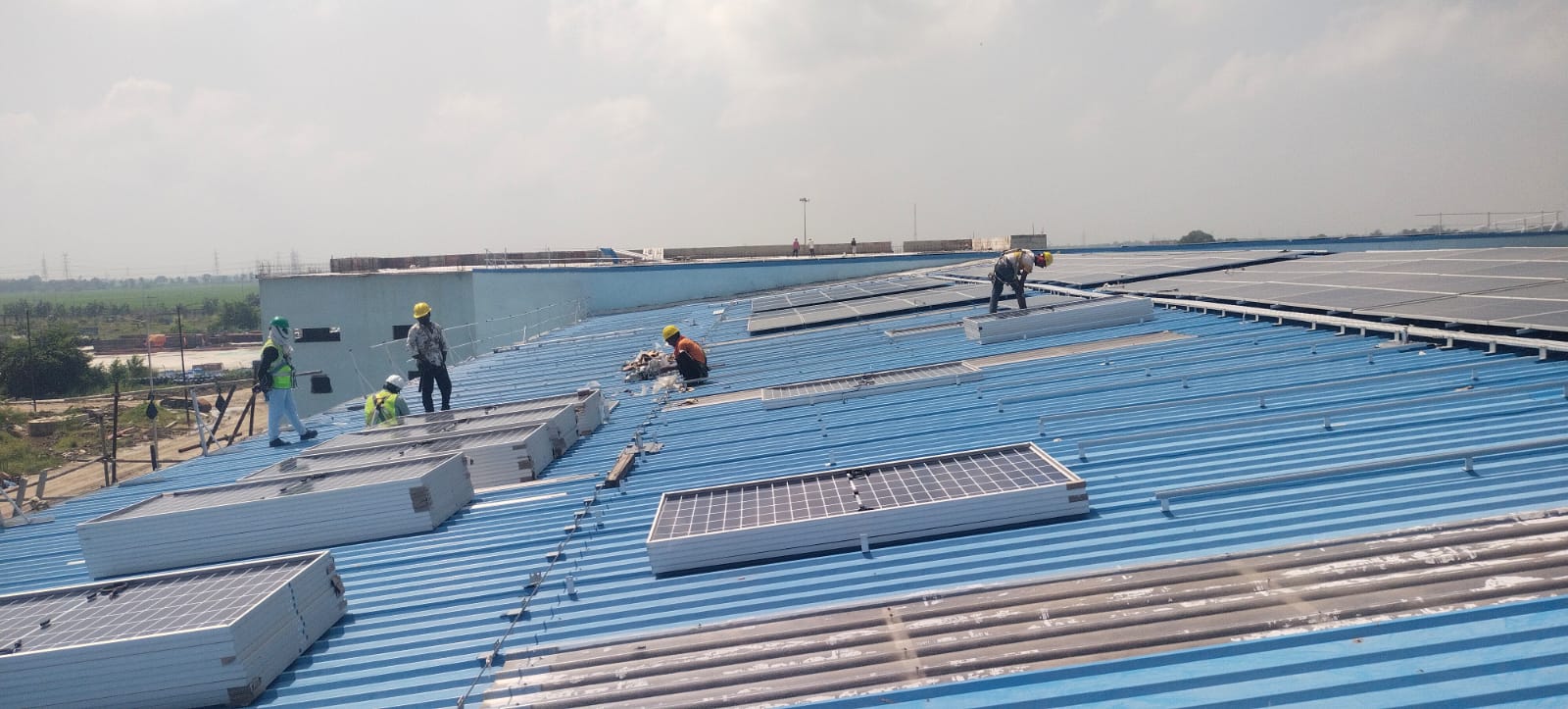 Bloom Bharat Solar Engineers on Industrial Rooftop
